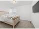 Relaxing bedroom with neutral carpet and a comfortable bed at 6591 N Ceylon St, Denver, CO 80249