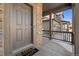 Inviting front porch and doorway with brick accents on a well-maintained home exterior at 6591 N Ceylon St, Denver, CO 80249