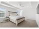 Spacious main bedroom with tray ceiling, plush carpet, and ample natural light at 6591 N Ceylon St, Denver, CO 80249