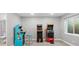 Finished recreation room with classic arcade games, creating a playful and entertaining space for all ages at 6591 N Ceylon St, Denver, CO 80249