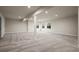 Spacious basement with carpet, recessed lighting, and windows for natural light at 5302 Pinehurst Dr, Boulder, CO 80301