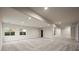 Large basement with carpet and recessed lighting, with potential for customization at 5302 Pinehurst Dr, Boulder, CO 80301