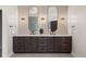 Elegant bathroom featuring a dual vanity, stylish lighting, and modern fixtures at 5302 Pinehurst Dr, Boulder, CO 80301
