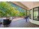 Spacious deck with comfortable seating is surrounded by lush greenery, perfect for outdoor entertaining at 5302 Pinehurst Dr, Boulder, CO 80301