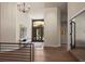 Elegant foyer featuring hardwood floors, high ceilings, and a view of the front entrance, enhanced by tasteful decor at 5302 Pinehurst Dr, Boulder, CO 80301