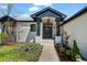 Inviting front entrance with a covered porch, showcasing the house number and well-maintained landscaping at 5302 Pinehurst Dr, Boulder, CO 80301