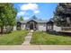 Charming single-story home with well-manicured lawn, lovely landscaping, and welcoming entry at 5302 Pinehurst Dr, Boulder, CO 80301