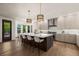 Kitchen featuring a large island with counter seating, stainless steel appliances, and pendant lighting at 5302 Pinehurst Dr, Boulder, CO 80301