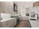 Modern kitchen with stainless steel appliances and light wood cabinetry at 5302 Pinehurst Dr, Boulder, CO 80301