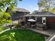 Charming backyard with deck, patio furniture, and lush green lawn at 2734 King St, Denver, CO 80211