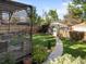 Charming backyard with a pergola, lush greenery, and a well-maintained lawn at 2734 King St, Denver, CO 80211