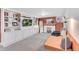 Finished basement features built-in shelving, a cozy seating area, and carpet flooring at 2734 King St, Denver, CO 80211