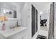 Cozy bathroom featuring a single vanity, patterned shower curtain, and modern accents at 2734 King St, Denver, CO 80211