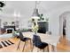 Open dining area with hardwood floors connecting to living room, perfect for entertaining at 2734 King St, Denver, CO 80211