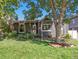 Charming home exterior with a well-manicured front lawn and mature trees at 2734 King St, Denver, CO 80211