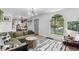 Inviting living room featuring hardwood floors, ample natural light, and stylish furnishings at 2734 King St, Denver, CO 80211