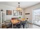 Dining room features a light wood table with black chairs and decor at 8170 E Phillips Cir, Centennial, CO 80112