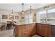 Bright kitchen with granite countertops, stainless steel appliances, tile floors, and access to the dining area at 8170 E Phillips Cir, Centennial, CO 80112