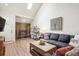 Inviting living room with wood floors, a cozy fireplace, and a comfortable sectional sofa at 8170 E Phillips Cir, Centennial, CO 80112