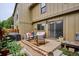 Cozy outdoor patio area, furnished with seating, a grill, and decorative plants, perfect for entertaining at 8170 E Phillips Cir, Centennial, CO 80112