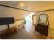 Finished attic space with hardwood floors, TV, and dresser at 614 Rose St, Georgetown, CO 80444