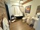 Elegant bathroom featuring a modern tub, rustic wood accent wall, and stylish fixtures at 614 Rose St, Georgetown, CO 80444