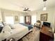 Bedroom with a full size bed, decorative rug, ceiling fan, and artwork at 614 Rose St, Georgetown, CO 80444