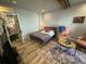 Bedroom with wood floors, area rug, sitting area, and a full bed at 614 Rose St, Georgetown, CO 80444