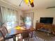 Inviting dining room with a wooden table set, large windows, and classic ceiling fan at 614 Rose St, Georgetown, CO 80444