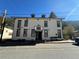 Charming multi-story exterior with classic architectural details and a welcoming entrance with benches at 614 Rose St, Georgetown, CO 80444