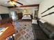 Open concept living space with a sofa, dining area, and bedroom featuring wood beam at 614 Rose St, Georgetown, CO 80444