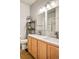 Bathroom features double sinks, a well-lit vanity, and modern fixtures at 7848 W 54Th Ave, Arvada, CO 80002