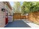 Cozy back deck with privacy screen and outdoor lighting, perfect for enjoying the outdoor living space at 3644 Rosewalk Cir, Highlands Ranch, CO 80129