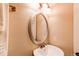 Bathroom mirror is round and has updated faucet at 3644 Rosewalk Cir, Highlands Ranch, CO 80129