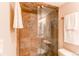 Newly tiled stand-up shower with glass door provides a sleek, contemporary design at 3644 Rosewalk Cir, Highlands Ranch, CO 80129