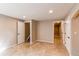 Spacious bonus room with multiple doorways and tile flooring throughout at 3644 Rosewalk Cir, Highlands Ranch, CO 80129