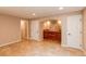 Spacious bonus room with recessed lights and tiled floors, perfect for entertaining at 3644 Rosewalk Cir, Highlands Ranch, CO 80129