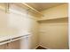 Empty closet with shelving and hanging rods, ready for customization at 3644 Rosewalk Cir, Highlands Ranch, CO 80129