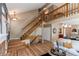 Spacious foyer with hardwood floors, staircase, and open access to other living spaces at 3644 Rosewalk Cir, Highlands Ranch, CO 80129