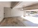 Spacious garage with a concrete floor and an automatic door, offering secure parking and storage at 3644 Rosewalk Cir, Highlands Ranch, CO 80129