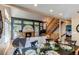 Open concept living area and staircase at 3644 Rosewalk Cir, Highlands Ranch, CO 80129