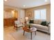 Inviting living room boasts neutral tones, natural light, and a cozy seating arrangement at 3644 Rosewalk Cir, Highlands Ranch, CO 80129