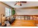 Charming loft area with hardwood floors, a comfortable sitting area, and abundant natural light at 3644 Rosewalk Cir, Highlands Ranch, CO 80129