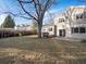 Large backyard featuring a hot tub, mature tree, swing set, and patio space at 9930 W 82Nd Ave, Arvada, CO 80005