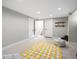 Finished basement featuring carpet flooring, ample space and storage shelves at 9930 W 82Nd Ave, Arvada, CO 80005