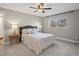 Well-lit bedroom with ceiling fan, plush carpet, and neutral tones promotes calm and relaxation at 9930 W 82Nd Ave, Arvada, CO 80005