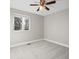 Bedroom with neutral walls, carpet flooring, ceiling fan, and a window with a view at 9930 W 82Nd Ave, Arvada, CO 80005