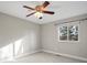 Neutral bedroom featuring carpet flooring, ceiling fan, and a window providing natural light at 9930 W 82Nd Ave, Arvada, CO 80005