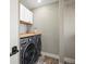 Laundry room with front load washer/dryer and butcher block countertop at 9930 W 82Nd Ave, Arvada, CO 80005