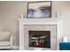 Cozy fireplace and white mantel creates an inviting focal point in the living room at 9930 W 82Nd Ave, Arvada, CO 80005